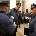 11/09/2017 Boston Ma - Colonel Richard D. McKeon (cq) middle Superintendent of the Massachusetts Stet Police at the Massachusetts State Police Awards Ceremony at the State House. He was preparing to hand out awards. (Jonathan Wiggs\Globe Staff) Reporter:Topic.