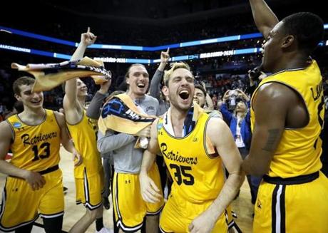 CHARLOTTE, NC - MARCH 16: The UMBC Retrievers bench reacts to their 74-54 victory over the Virginia Cavaliers during the first round of the 2018 NCAA Men's Basketball Tournament at Spectrum Center on March 16, 2018 in Charlotte, North Carolina. (Photo by Streeter Lecka/Getty Images)
