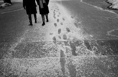 Boston, MA., 03/21/18, Footprints have formed in the salt on the pavement on the Boston Common as a fourth storm approaches Boston this month. Suzanne Kreiter/Globe staff
