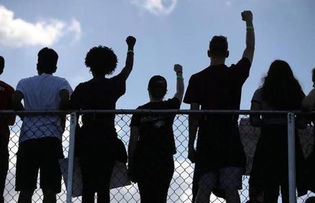 Marjory Stoneman Douglas High School students held their fists up.
