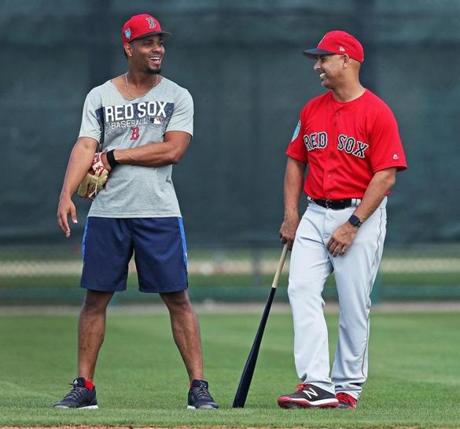 Fort Myers, FL 2/15/2018: Red Sox manager Alex Cora (right) smiles as he talks to shortstop Xander Bogaerts (left) in the infield dueing a workout. Spring Training for the Red Sox continued today at the Player Development Complex at Jet Blue Park. (Jim Davis/Globe Staff)
