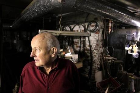 The basement is crowded with machines Bill Quill used during restoration of his 18th century mansion, purchased for $200,000 in 1984. Four years later, it caught on fire. 
