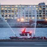 Massport Fire-Rescue boats fired their water cannons as the New England Patriots arrived at Logan Airport. 