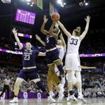 Notre Dame's Jackie Young (5) shoots as Connecticut's Katie Lou Samuelson (33) defends and teammate Jessica Shepard (23) watches during the second half in the semifinals of the women's NCAA Final Four college basketball tournament, Friday, March 30, 2018, in Columbus, Ohio. (AP Photo/Tony Dejak)
