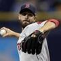 Boston Red Sox's Rick Porcello pitches to the Tampa Bay Rays during the first inning of a baseball game Saturday, March 31, 2018, in St. Petersburg, Fla. (AP Photo/Chris O'Meara)