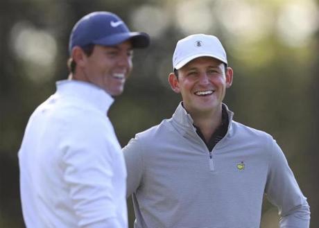 Matt Parziale (right), a 30-year-old firefighter and the US Mid-Amateur champion, chats with Rory McIlroy during a practice round for the Masters on Monday.
