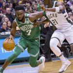 Boston Celtics guard Jaylen Brown, left, drives to the basket against Milwaukee Bucks guard Tony Snell, right, during the second half of an NBA basketball game Tuesday, April 3, 2018, in Milwaukee. (AP Photo/Darren Hauck)