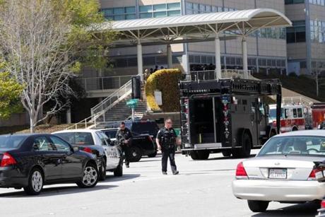 Police vehicles lined the street outside YouTube headquarters in San Bruno, Calif.
