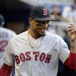 Boston Red Sox's Mookie Betts walks in the dugout before a baseball game against the Miami Marlins, Monday, April 2, 2018, in Miami. (AP Photo/Lynne Sladky)