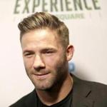 New England Patriots Julian Edelman poses for a picture at the opening of 