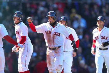 Boston04/07/18 Boston Red Sox vs Tampa Bay Rays- A jubilant Sox Xander Bogaerts runs to the dugout with Mookie Betts(left), J.D. Martinez(left) and Andrew Benintendi after his grand slam homer in the 2nd inning.Photo by John Tlumacki/Globe Staff(sports)
