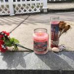 On Sunday morning, a small shrine had been put together on a Frazer Street curb, including two candles, flowers, and a pair of seashells, to mark the death of a 27-year-old resident. The shooting remains under active investigation.