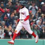 Boston, MA: 4/8/2018: The Red Sox Mookie Betts is walking on air as he scores Boston's sixth run of the bottom of the eighth inning on a double by teammate Andrew Benintendi. The run gave the Red Sox an 8-7 lead, which would be the final score. The Boston Red Sox hosted the Tampa Bay Rays in a regular season baseball game at Fenway Park. (Jim Davis/Globe Staff)
