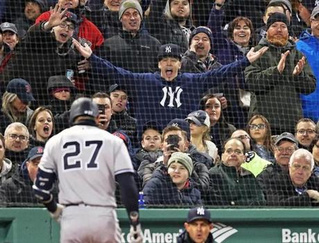 Boston, MA: 4/9/2018: The Yankees Giancarlo Stanton even hears it from a New York fan after he struck out for the second time in the game. The Boston Red Sox hosted the New York Yankees in a regular season MLB baseball game at Fenway Park. (Jim Davis/Globe Staff)
