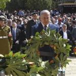 Israeli Prime Minister Benjamin Netanyahu lays a wreath during a ceremony marking the annual Holocaust Remembrance Day at Yad Vashem Holocaust Memorial in Jerusalem, Thursday, April 12, 2018. The somber day is the national memorial for the 6 million Jews killed by Nazi Germany and its collaborators in World War Two. (Debbie Hill/Pool via AP)