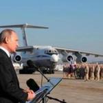 FILE - This file Dec. 12, 2017 file photo, Russian President Vladimir Putin addresses the troops at the Hemeimeem air base in Syria. With the Middle East on edge and many fearing inadvertent triggering of regional war, it is easy to forget that two weeks ago Trump shocked advisers in declaring an intention to withdraw troops from Syria. Now, apparently angered by a suspected chemical attack, Trump is threatening imminent military strikes against the Syrian government forces he blames and rattling a saber at Syria?s patron Russia. (, File)