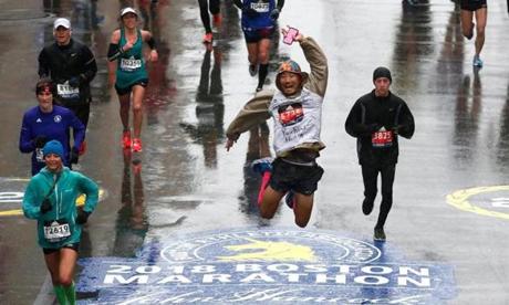MARATHON SLIDER Boston, MA--4/16/2018-- Yuichiro Hidaka kicked his heels as he approached the finish line of the 122nd Boston Marathon. (Jessica Rinaldi/Globe Staff) Topic: Reporter:
