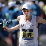 Hopkinton - Boston, MA - 04/017/17 - Galen Rupp grabs water after the 11 mile mark of the 121st running of the Boston Marathon. (Lane Turner/Globe Staff) Reporter: (various) Topic: ()