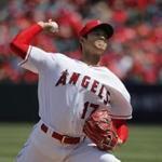 Los Angeles Angels starting pitcher Shohei Ohtani, of Japan, throws against the Oakland Athletics during the first inning of a baseball game, Sunday, April 8, 2018, in Anaheim, Calif. (AP Photo/Jae C. Hong)