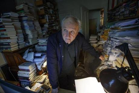 Poet Frank Bidart posed for a portrait in his Cambridge home in August.
