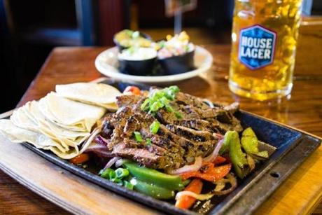 Get two-for-one fajitas at Olde Magoun?s Saloon.
