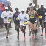 The elite men?s runners chugged through the rain during the Boston Marathon Monday.  