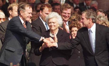 Barbard Bush watched as her husband, President George H.W. Bush, congratulated their son, George W. Bush, when he was inaugurated as Texas governor in 1999.

