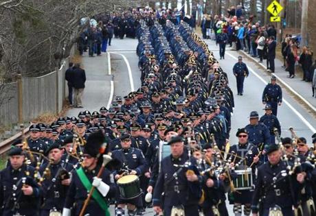 Bagpipers led police from all over the country in a procession to St. Pius X Church on Tuesday.
