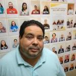 Ben Echevarria, executive director of The Welcome Project, posed in front of the group?s ?DACA Wall.? 