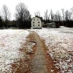 A snow-covered field for spring in April at The Old Manse in Concord. 