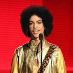 FILE - In this Nov. 22, 2015, file photo, Prince presents the award for favorite album - soul/R&B at the American Music Awards in Los Angeles. A Minnesota doctor accused of illegally prescribing an opioid painkiller for Prince a week before the musician died from a fentanyl overdose has agreed to pay $30,000 to settle a federal civil violation, according to documents made public Thursday, April 19, 2018. Prince was 57 when he was found alone and unresponsive in an elevator at his Paisley Park estate on April 21, 2016. An autopsy found he died of an accidental overdose of fentanyl. (Photo by Matt Sayles/Invision/AP, File)