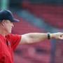 Boston, MA: August 31, 2017: Red Sox manager John Farrell is pictured as he signals to someone in the outfield during batting practice. The Boston Red Sox hosted the Toronto Blue Jays in a regular season MLB baseball game at Fenway Park. (Jim Davis/Globe Staff).