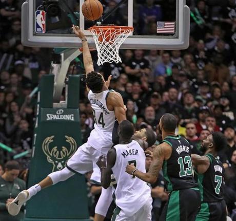 Milwaukee, WI: 4-22-18: The Bucks Giannis Antetokounmpo (34) tips home the game winning basket that gave Milwaukee a 104-102 lead with 5.1 seconds left in the game. The Boston Celtics visited the Milwaukee Bucks for Game Four of their NBA Eastern Conference first round playoff series at the Bradley Center. (Jim Davis/Globe Staff)
