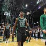 Milwaukee, WI: 4-22-18: As Milwaukee's Jabari Parker and Thon Maker celebrate in the backround far left, the streamers celebrating the Bucks victory start to fall from the rafters, At the same time the Celtics Terry Rozier III (12) and teammate Aron Baynes (right) head off the courrt following their 104-102 loss that tied the series at 2-2. The Boston Celtics visited the Milwaukee Bucks for Game Four of their NBA Eastern Conference first round playoff series at the Bradley Center. (Jim Davis/Globe Staff)
