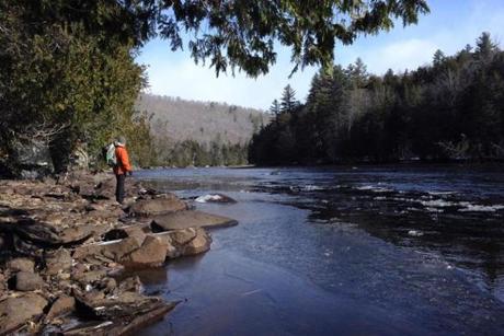 Russell Walters paused by the Kennebec River. A proposed hydropower line would cross over the Kennebec River Gorge. 
