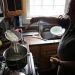 Food historian Ken Albala removes cooked noodes from boiling water. 