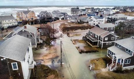 On March 5, seawater made streets impassable in this Oceanside Drive neighborhood in Scituate during high tide.
