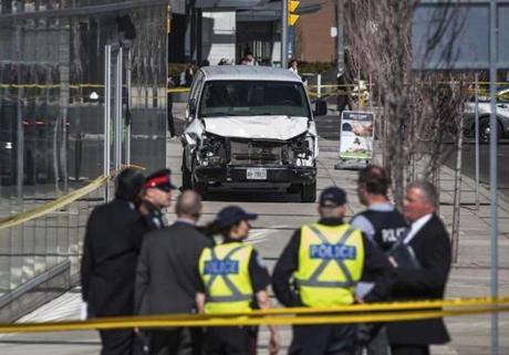The sidewalk was strewn with bodies and injured pedestrians after the van jumped the curb and traveled about a mile, a witness said.
