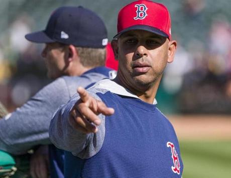 Boston Red Sox manager Alex Cora watches batting practice before a baseball game against the Oakland Athletics in Oakland, Saturday, April 21, 2018. (AP Photo/John Hefti)
