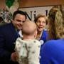 Representative Nick Collins (left) introduced US Senator Elizabeth Warren to his wife, Olivia, and their 3-month-old baby, Justine, during a Get Out the Vote Rally on Saturday in Boston.