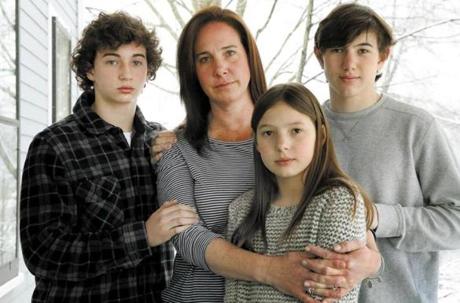 Alexis Weisz (second from left) posed with her children (left to right) Maxwell, 13, Grace, 11, and Logan, 16, at their home in Bedford. Weisz?s husband, Christopher, was struck and killed last year, allegedly by a driver with past drunken driving convictions.
