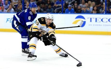 TAMPA, FL - APRIL 30: Brad Marchand #63 of the Boston Bruins and Anton Stralman #6 of the Tampa Bay Lightning fight for the puck during Game Two of the Eastern Conference Second Round during the 2018 NHL Stanley Cup Playoffs at Amalie Arena on April 30, 2018 in Tampa, Florida. (Photo by Mike Ehrmann/Getty Images)
