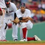 Boston- 04/28/18- Boston Red Sox vs Tampa Bay Rays- Sox Xander Bogaerts takes a knee in the 6th inning after being shaken up trying to catch a fly pop hit by Rays Adeiny Hechavarria. Photo by John Tlumacki/Globe Staff(sports)