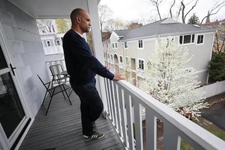 Christopher Love stood on the porch of his home, overlooking the parking area where he was arrested.

