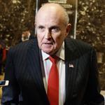 Former New York City mayor Rudy Giuliani spoke with reporters in the lobby of Trump Tower last year. 