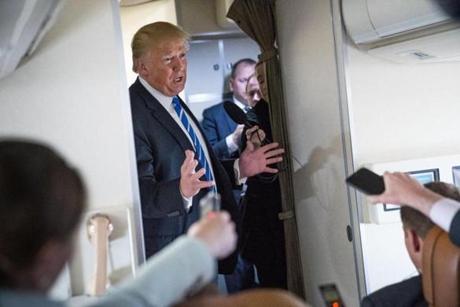 FILE-- President Donald Trump speaks to reporters aboard Air Force One as he heads back to Washington following a trip to West Virginia, on Thursday, April 5, 2018. Trump reimbursed Michael Cohen, his longtime personal lawyer, for a $130,000 payment that Cohen has said he made to keep a pornographic film actress from going public before the 2016 election with her story about an affair with Trump, according to Rudolph Giuliani, one of the president?s lawyers. (Doug Mills/The New York Times)
