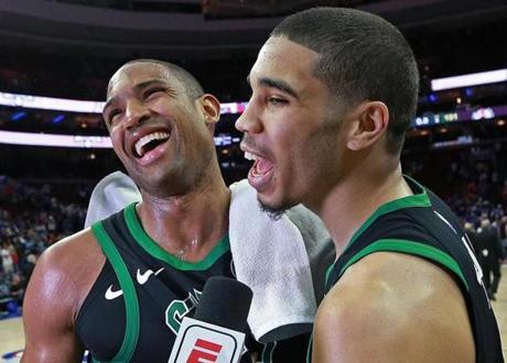 Philadelphia, PA: 5-5-18:As the Celtics Al Horford (left) was doing a post game interview, teammate Jayson Tatum jumped in and called him 