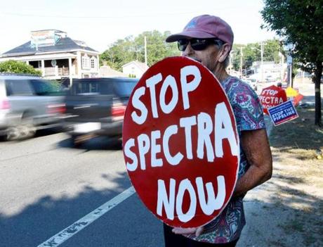 Weymouth, MA: 07-27-2016: Protestors opposing construction of a Spectra Energy natural gas compressor plant, including Dotty Anderson of Weymouth, line the roadway coming off the Fore River Bridge by the plant site in Weymouth, Mass. July 27, 2016. (Note: When photo was taken, there were seven protestors participating, but they were spread along the roadway and could not all be included in one photo.) Photo/John Blanding, Boston Globe staff story/Kathy McCabe, Metro ( 28weymouth )
