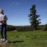 Nelson, NH- September 02, 2017: Connor Biscan stood atop a small rock and searched the sky for the balloons he had lost at a family gathering in Nelson, N.H., on Labor Day weekend last September. Connor had flown the balloons in an open field behind his great-grandfather's house. When the kite string broke and the balloons snagged on a tree, Connor became anxious. His mother, Roberta Biscan, praised him for remaining calm. As a baby, balloon was his first word. (Craig F. Walker/Globe Staff) section: metro reporter: kowalczyk