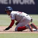Boston Red Sox's Mookie Betts (50) reacts after sliding hard to second base on a ground out by Andrew Benintendi during the first inning of a baseball game, Sunday, May 6, 2018, in Arlington, Texas. (AP Photo/Jim Cowsert)